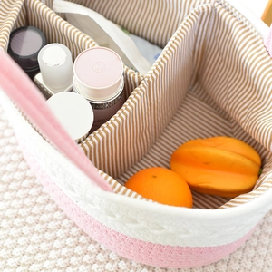 Detail view of cotton rope nursery basket showing three storage compartments and lining