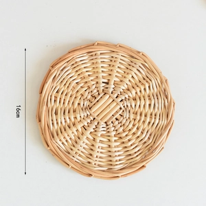 Close-up of a 16cm woven placemat showing natural texture and circular spiral pattern