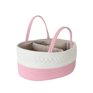 Pink and white woven cotton rope baby storage basket with handles and internal dividers