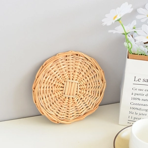 Macro detail of the woven texture on a round heat-resistant placemat in natural finish