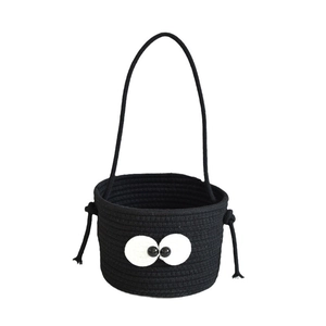 Handwoven black cotton storage basket featuring cute big eyes design with long handle