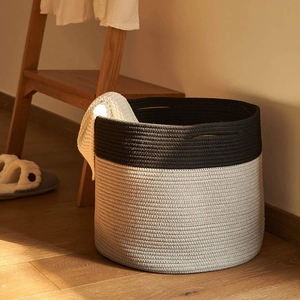 Close-up of dual-tone cotton rope weaving texture with durable handle on storage basket