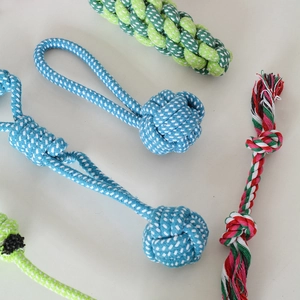 Detail of durable braided cotton rope knots for dogs in blue, green and tricolor