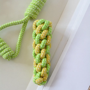 Detailed view of durable braided cotton rope chew toys for dogs in green and white colors