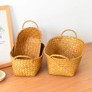 Detailed close-up showing texture of handmade woven storage baskets with handles