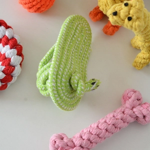 Detailed overhead view of durable braided cotton rope chew toys in various animal shapes