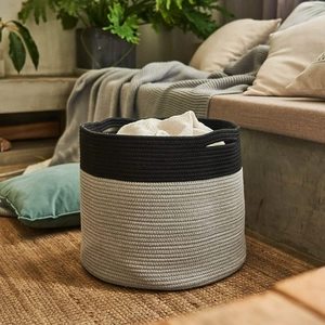 Detail of dual-tone cotton rope weave texture and integrated handles on the storage basket