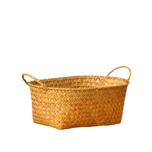 Handwoven natural seagrass storage basket with handles for organizing fruit or snacks