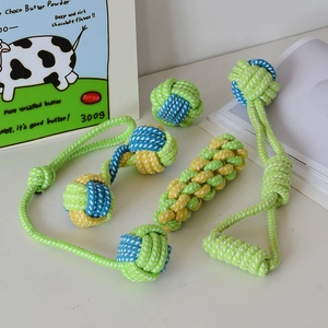 Close-up of durable cotton rope dog toys in green and blue for cleaning teeth