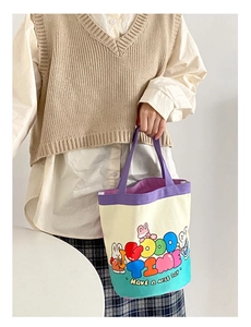 Detail of the cute graffiti canvas bucket bag with rabbit illustration and purple handles