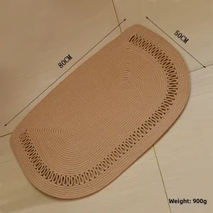 Detail of 80x50cm camel woven cotton rug with spiral texture and wave border