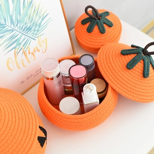 Handwoven orange persimmon cotton rope storage basket with lid for desktop organization