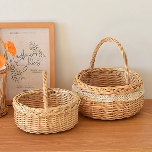 Close-up of hand-woven wicker storage baskets with white lace detail and natural wood finish