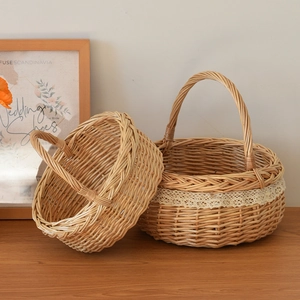 Close-up of hand-woven wicker basket featuring delicate beige lace trim and natural texture