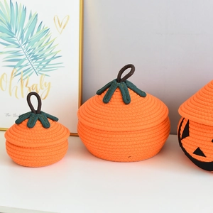 Detailed set of orange pumpkin cotton rope storage baskets with decorative green leaves