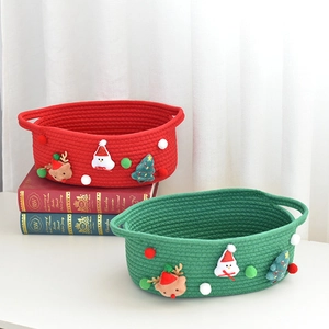 Detail of red and green woven Christmas gift baskets with festive 3D reindeer and snowman