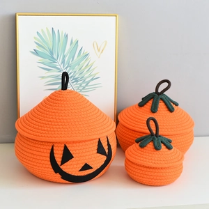 Three orange pumpkin-shaped cotton rope storage baskets in different sizes for home organizing