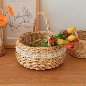 Handwoven willow picnic basket with white lace trim and sturdy handle for home storage