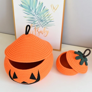 Set of two pumpkin cotton rope baskets with Jack-o'-lantern face and lid for home storage