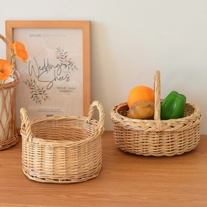 Detail of handcrafted willow picnic baskets featuring intricate woven textures and handles