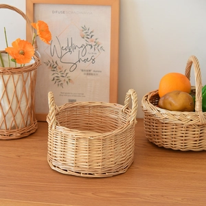 Detail of hand-woven wicker storage basket with sturdy round handles and natural texture