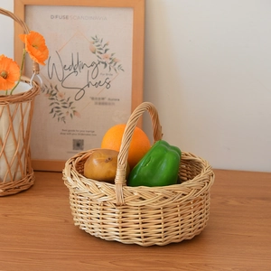 Close-up of woven wicker basket with handle showing natural texture and fresh fruits
