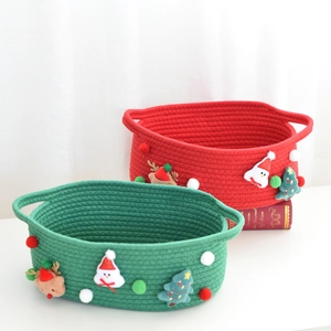 Detail of Christmas cotton rope gift baskets with festive plush reindeer and snowman decor