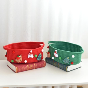 Detail of Christmas cotton rope gift baskets with festive felt snowman and reindeer decor