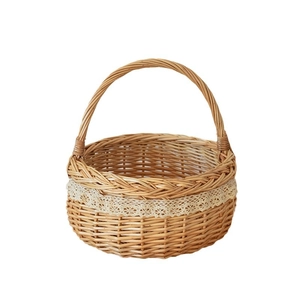 Handcrafted wicker picnic basket with white lace trim and sturdy handle for home storage