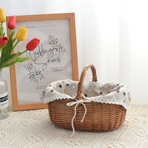 Close-up of hand-woven wicker picnic basket with polka dot lining and lace trim edge