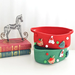 Christmas woven storage baskets with reindeer and tree decor in red and green cotton rope