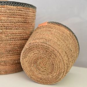 Close-up of handwoven Nordic storage basket showing seagrass texture and leather tag