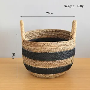 Detail view of woven storage basket with dual handles and dimensions of 26cm diameter and 20cm height