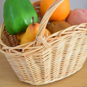 Detailed close-up of the woven willow basket showing natural texture and sturdy handle