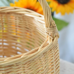 Macro view of woven willow basket showing detailed texture and natural wood finish