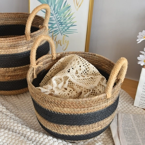 Set of two woven wicker baskets with black stripes and thick handles for home storage