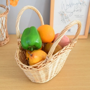 Close-up of hand-woven wicker storage basket with sturdy handles and natural willow texture