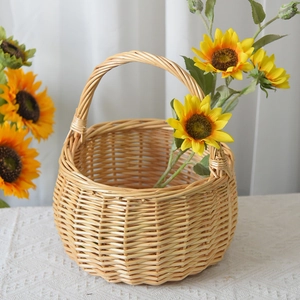 Detail of hand-woven willow basket with sunflowers used as home floral decor