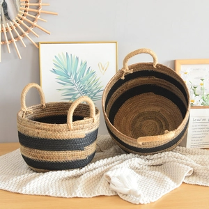 Detailed view of two-piece woven storage baskets with black stripes and sturdy handles