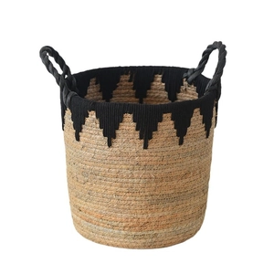 Handwoven straw storage basket with black fringe detail and durable rope handles