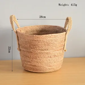 Detail view of woven straw basket with dimensions 28cm diameter and 22cm height