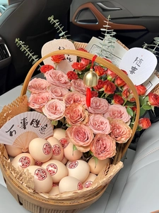 Detail of a handmade wooden gift basket with roses, decorated eggs, and lucky charms