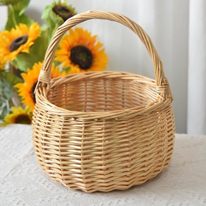 Detail of hand-woven wicker storage basket with sturdy handle in natural rustic style