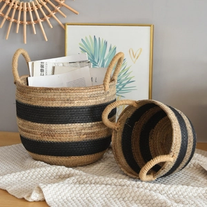 Two-piece woven rattan storage basket set with black stripes and circular handles