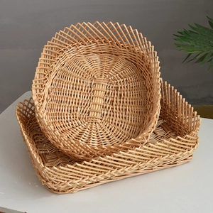 Detail of hand-woven wicker basket set with intricate wave patterns for home storage