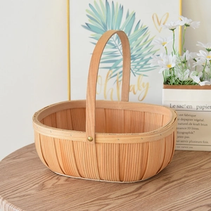 Macro shot of a hand-woven natural wood picnic basket with sturdy metal rivet handle