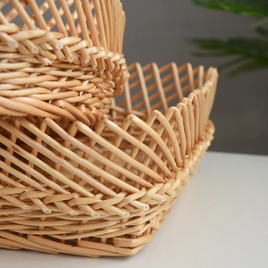 Detailed close-up showing the intricate natural wicker weave texture of woven storage baskets