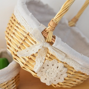 Close-up of handwoven wicker basket edge featuring beige lace and cotton liner details