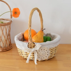 Close-up of woven wicker basket featuring white lace lining and decorative floral accents