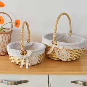 Detailed macro view of woven wicker gift baskets with lace lining and fabric floral accents